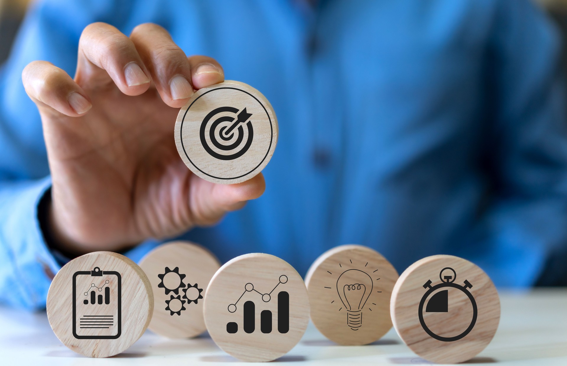 Hand holding wood block choose target icon business, target goal, market goal, consumer, digital marketing, strategy, action plan, achievement, success, financial growing, business development